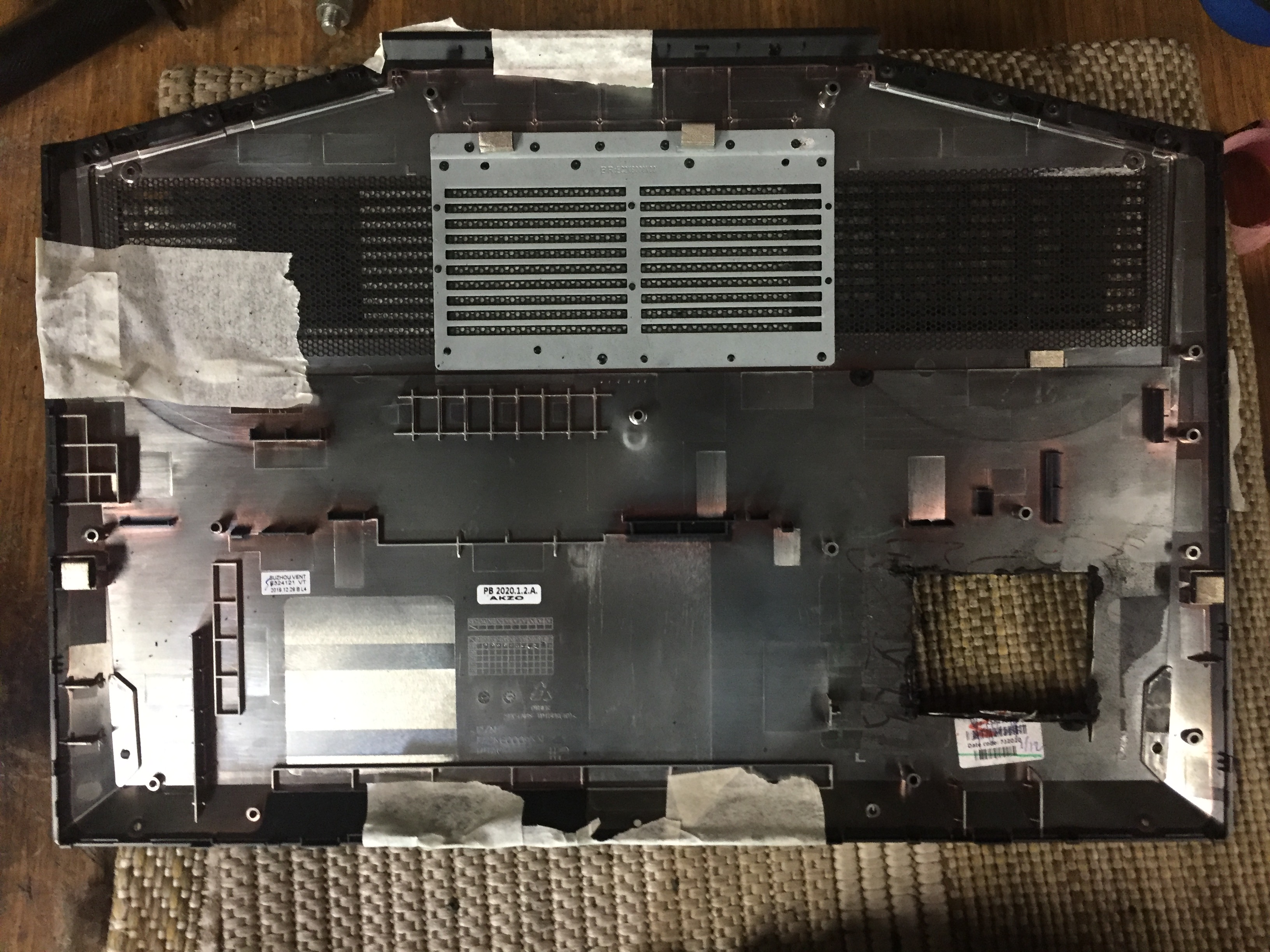 Bottom cover of the laptop with an initial test cut.