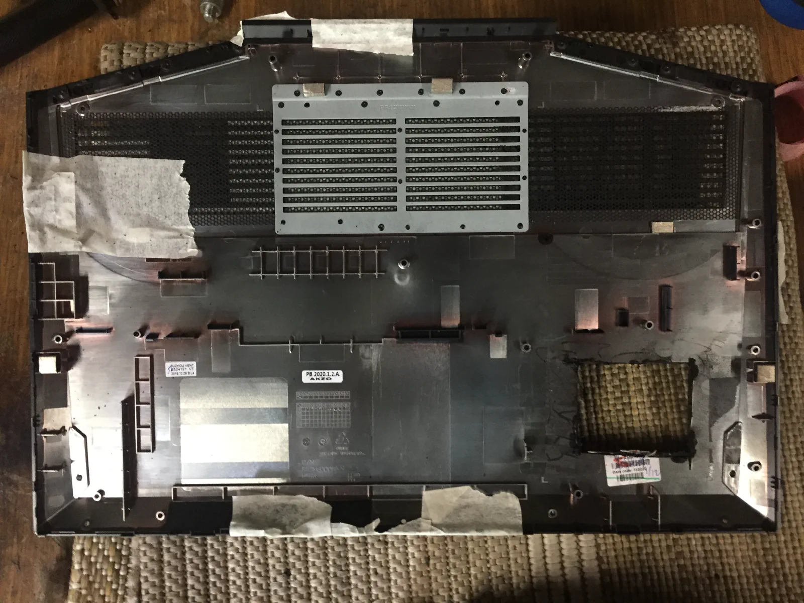 Bottom cover of the laptop with an initial test cut.
